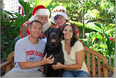Toby at Christmas with his family and Mr. and Mrs. Claus